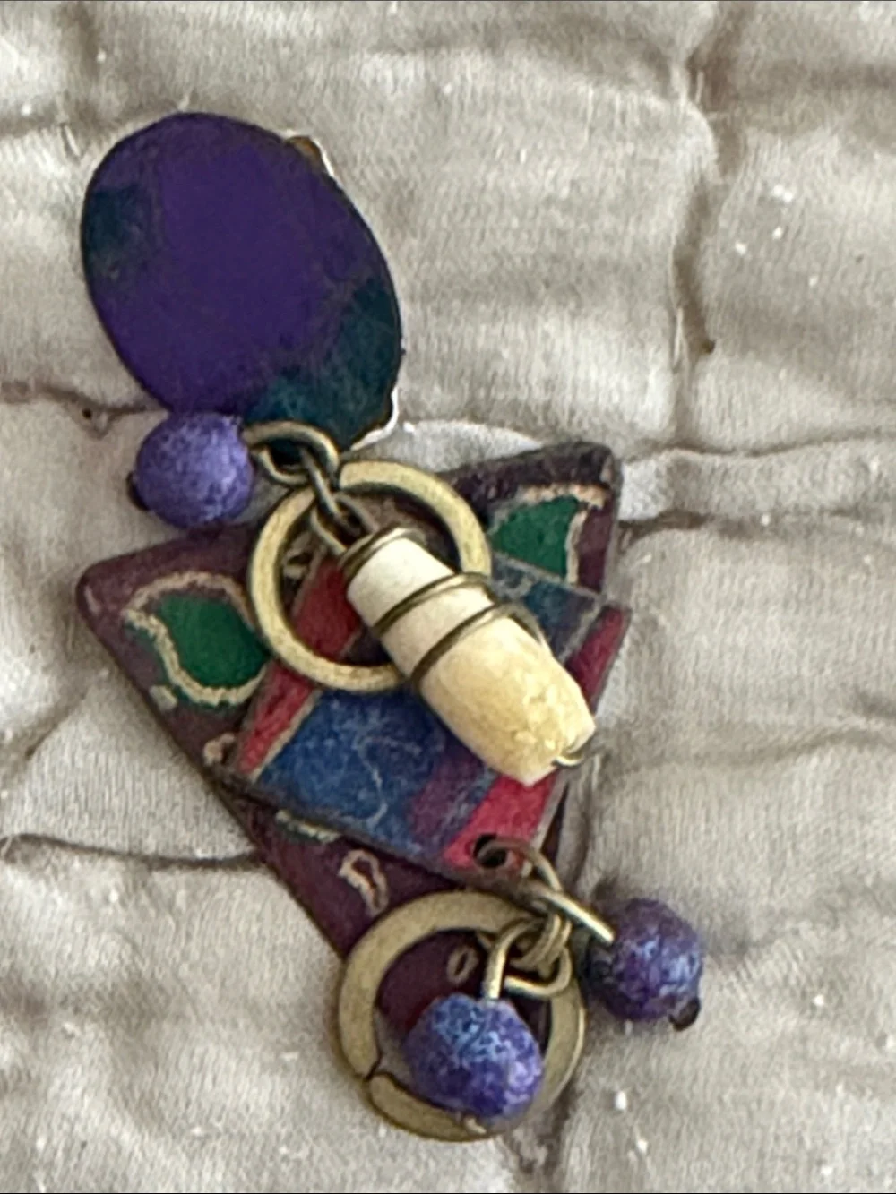 Clip style earrings artist made abstract metal pieces with attached panels